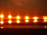 A Multiple Exposure of a Beautiful Arctic Sunset Photographic Print by Paul Nicklen