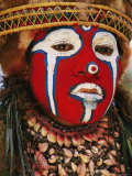 A Tribal Woman Clad with Shell Necklaces and Bright Face Paint Photographic Print