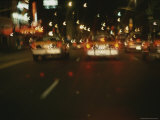 Cars on a Busy New York Street at Night Photographie
