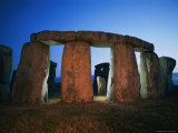 A View of Stonehenge Silhouetted by Lights at Twilight Photographic Print by Richard Nowitz