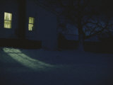 Golden Light Flows out of a Window on a Winter Night Photographie