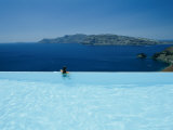 A Swimmer Enjoys the View from a Pool Overlooking the Aegean Photographic Print by Todd Gipstein