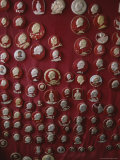 Pins with the Likeness of Mao Tse Tung Adorn a Communist- Red Fabric Photographie