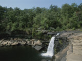 A Waterfall Cascades into a Pool of Water Photographic Print by Medford Taylor