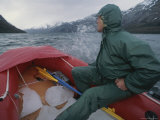 Rafting Across Fjord of the Mountains in an Inflatable Boat Photographic Print by Gordon Wiltsie