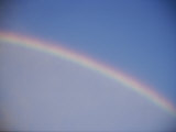 A Rainbow Arcs Across the Sky Above Salt Lake City, Utah Photographic Print