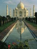 The Taj Mahal with a Reflection of the Tomb on the Surface of a Pool Photographic Print by Ed George