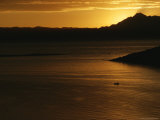 A View of Lake Titicaca at Sunset with a Small Boat Photographic Print