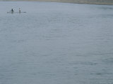 A Bicyclist is Ferried Across the Li River on a Narrow Raft Photographic Print by Raul Touzon