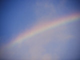 A Rainbow Arcs Across the Sky Above Salt Lake City, Utah Photographic Print