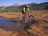 Cyclist Going Through Puddle, Arizona Photographic Print by David Edwards
