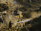 Gold Miners Blast Muddy Holes in the Earth with Water Photographic Print by Steve Winter