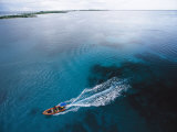A Skiff Crosses Kantons Lagoon on a Survey of Phoenix Islands Photographic Print by Paul Nicklen