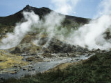 Steam Rising from Geothermal Springs in Kamchatkas Volcanic Region Photographic Print