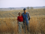 A Smiling Couple Pose in a Cornfield Photographic Print by Joel Sartore