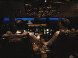 Pilots Sitting in the Cockpit at Night Photographic Print