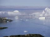 Icebergs from the Ilulissat Glacier Float by a Fishing Village Photographic Print