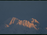 Sunlight on the Peaks of Snow Covered Mountains in Manitoba Photographic Print