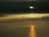 Beam of Sunlight Reflecting on Top of Low-Lying Clouds Photographic Print by Klaus Nigge
