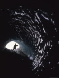 Hiker at the Entrance of an Ice Cave Under Root Glacier Photographic Print