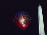 Red, White, and Blue Fireworks Light up the Sky Next to the Washington Monument Photographic Print