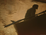 A Person in a Boat Reflected in a River Photographic Print