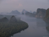 Small Islands, Tall Cliffs, and Thick Forests Border a Winding Bay Photographie