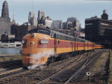 A Train on the Tracks with the Chicago Skyline in the Background Photographic Print
