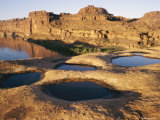 View of Water-Filled Depressions in Rock Formations Near the Colorado River Photographic Print by Stephen Alvarez