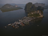 A Floating Village Clings to the Backside of a Mountainous Island Photographie