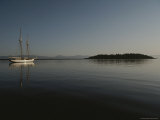 A Schooner Sits Moored in Neah Bay as the Morning Sun Rises Photographic Print by Sam Abell