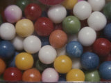 Close View of Colorful Gumballs in a Vending Machine Photographic Print