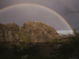 A Perfect Rainbow Arches over a Beaver Pond Protected by an Outcropping of Rock Photographic Print