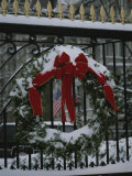 Fresh Snow Covers a Christmas Wreath on the White House Gate Photographic Print by Stephen St. John