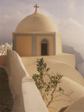 A Domed Church Clings to a Hillside on the Island of Thira Photographic Print