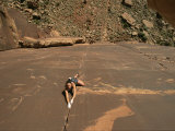 A Young Woman Climbing in Canyonlands, Utah Photographic Print by Jimmy Chin