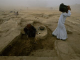 Workers Excavate Site of Ancient Pyramid Builders Production Center Photographic Print by Kenneth Garrett