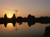 Karnak Ninth Pylon and a Crane Silhouetted against the Setting Sun Photographic Print