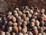 Terra Cotta Squid Pots Stacked against a Wall in a Portuguese Village Photographic Print by Medford Taylor