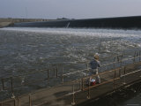 Fishing in the Waters at the Base of a Dam Photographic Print by Medford Taylor