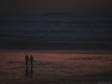 A Couple Strolls Along a Beach on the Olympic Peninsula at Twilight Photographic Print by Ted Spiegel
