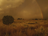 A Rainbow Appears over a Mesa as Storm Clouds Approach Photographic Print