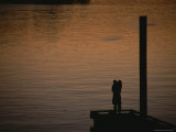 Lovers in an Embrace at Sunset on a Pier over Victoria Harbour Photographic Print by Todd Gipstein