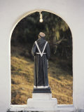 A Statue of a Monk Inside an Arch Photographic Print