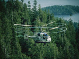 The Swirling Blades of a Helicopter Used for Logging Fill the Air Photographie