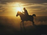 A Silhouetted Australian Cowboy at Twilight Photographic Print by Medford Taylor