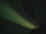 The Aurora Borealis Glows Brightly over the Mackenzie River Photographic Print by Raymond Gehman