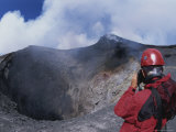 A Scientist is Seen Photographing a Crater on Mount Etna Photographic Print by Carsten Peter