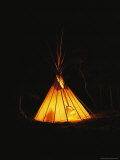 The Glow from a Campfire Makes a Shadow on a Tepee Photographic Print by Raymond Gehman