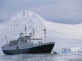 Tourists in a Kayak are Dwarfed by a Passenger Ship off Anvers Island Photographic Print